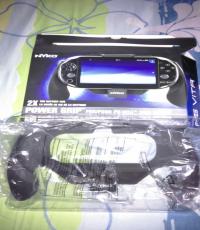 Ps Vita 2000 Nyko brand power grip plus portable charger inside.
