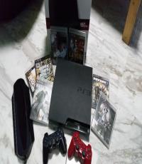 PS3 Console with 2 original controllers and 7 games