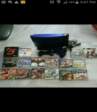 PS3 console and two controller with games