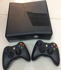 Xbox 360 console with 2 wireless controllers, wireless charger