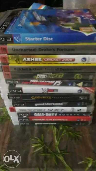 PS3 Super Slim console with 2 joystick and 12 dvd games